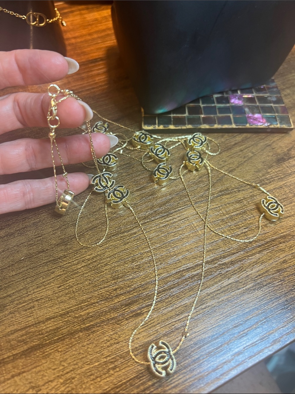 Gold-Tone Multi-Layer Logo Pendant Necklace - Picture 11 of 11